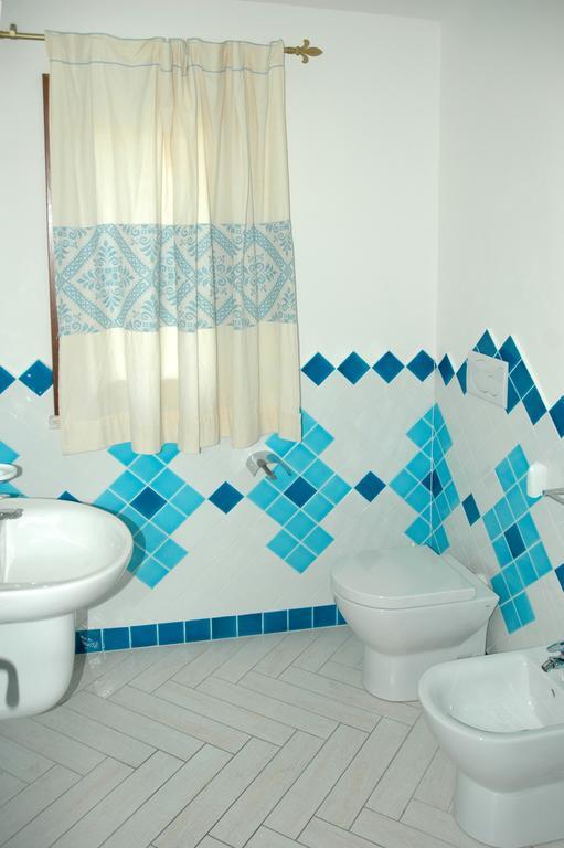 Holiday Homes Stella Marina Сан-Теодоро Номер фото